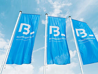 Three Blumenbecker flags in the sky